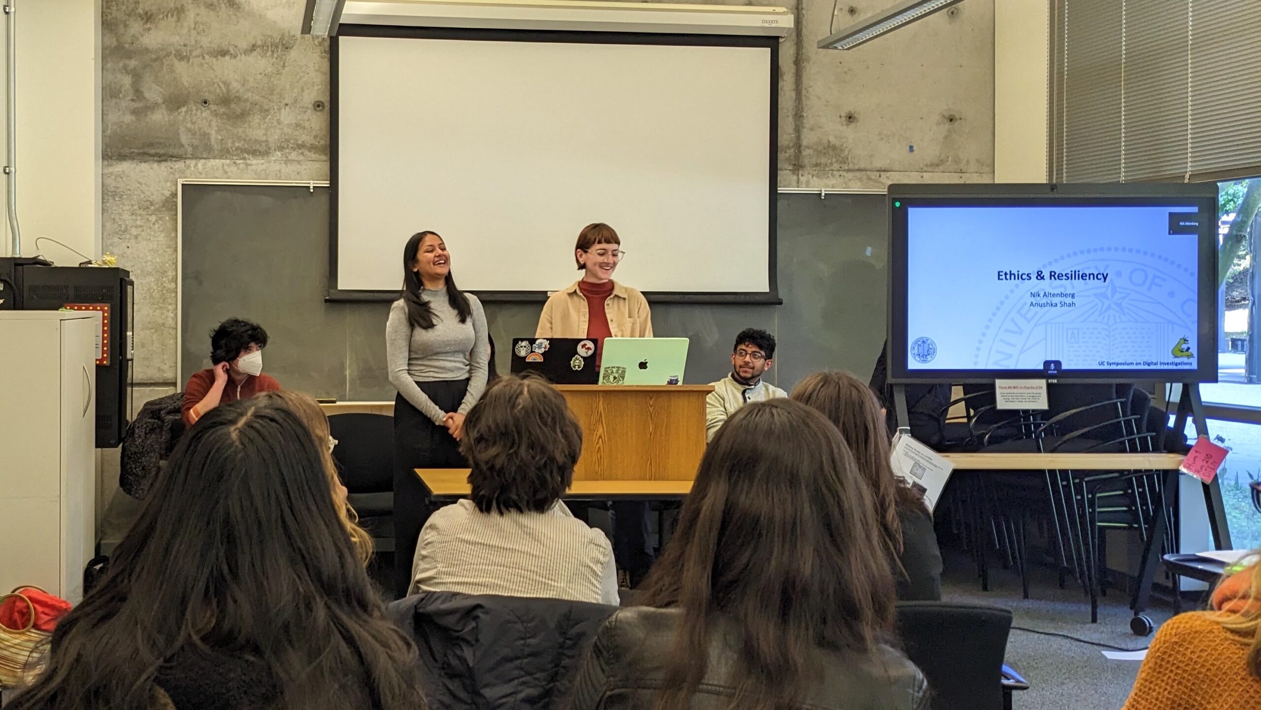 Nik and Anushka speaking at the symposium